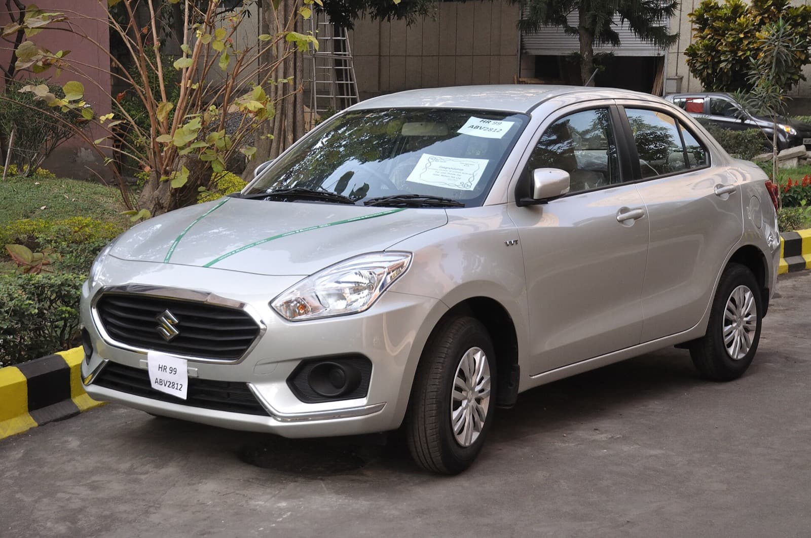 Maruti Suzuki Dzire sedan cab for outstation booking in Kolkata with chauffeur